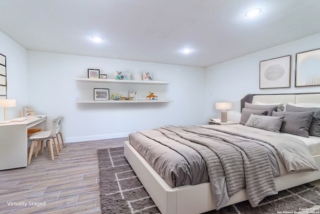 bedroom with wood-type flooring