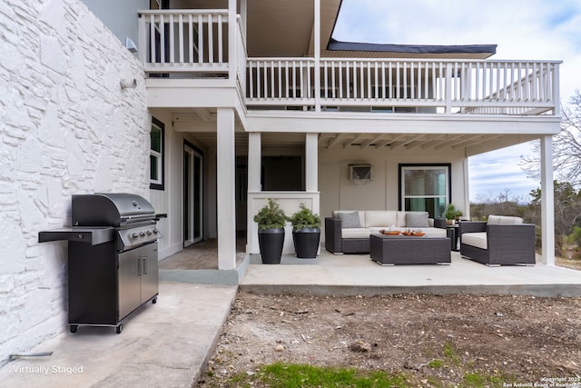 view of patio with a balcony, outdoor lounge area, and area for grilling