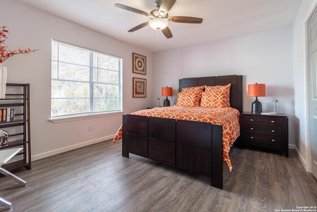 bedroom with ceiling fan and dark wood-type flooring