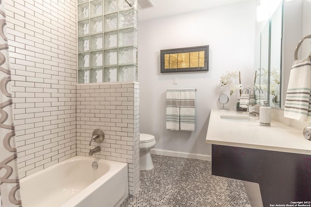 full bathroom with vanity, toilet, shower / bath combo with shower curtain, and tile patterned flooring