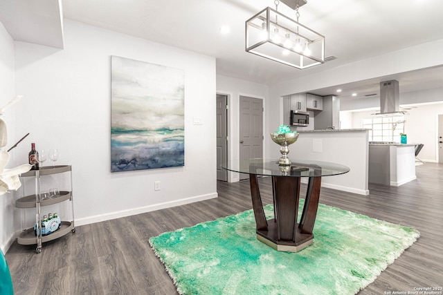 interior space featuring dark wood-type flooring and an inviting chandelier