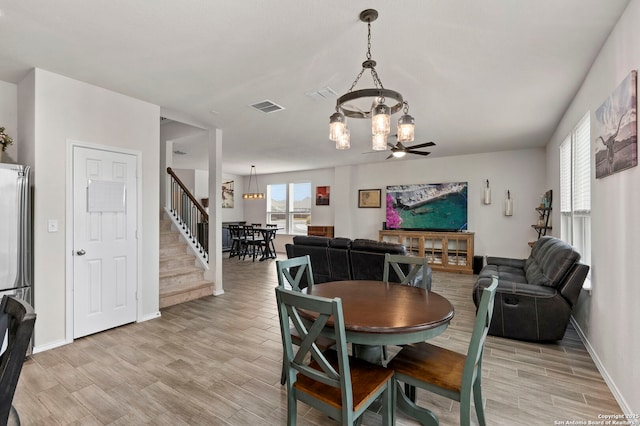 dining area with ceiling fan, light wood-type flooring, and a wealth of natural light