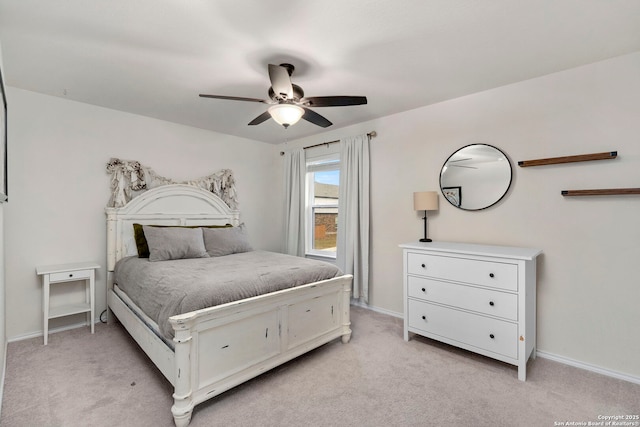 bedroom featuring light carpet and ceiling fan