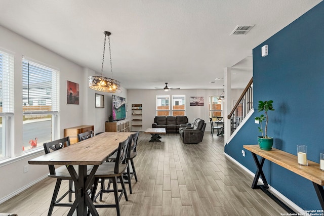 dining area with ceiling fan, light hardwood / wood-style floors, and plenty of natural light