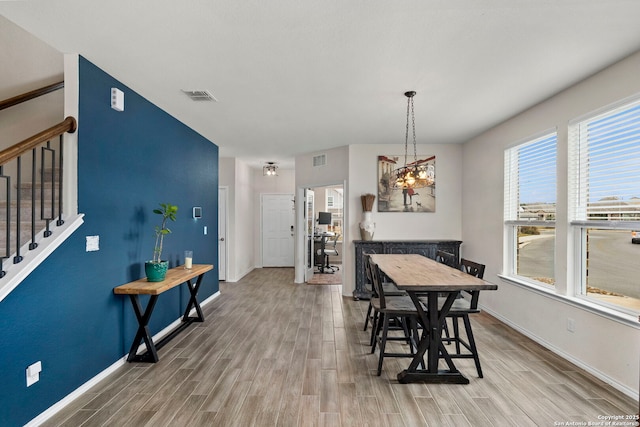 dining area featuring wood-type flooring