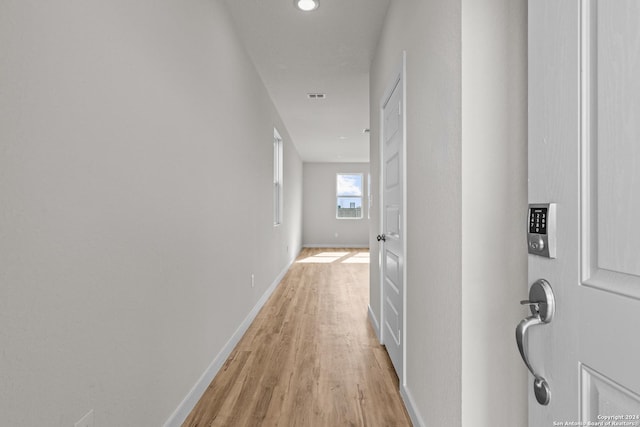 corridor featuring light wood-type flooring