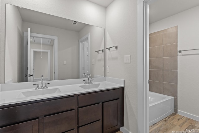 bathroom with hardwood / wood-style floors and vanity