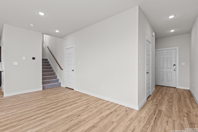 spare room with light hardwood / wood-style floors