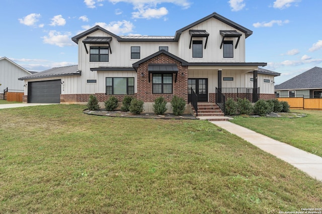 modern inspired farmhouse with a garage, a front lawn, and a porch