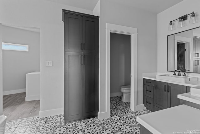 bathroom featuring toilet and vanity