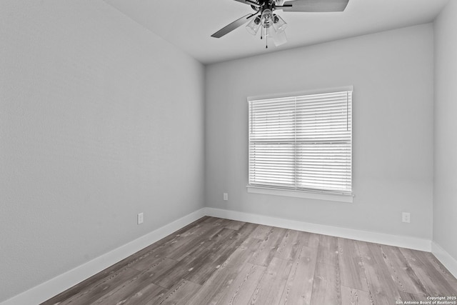 empty room featuring ceiling fan and light hardwood / wood-style floors