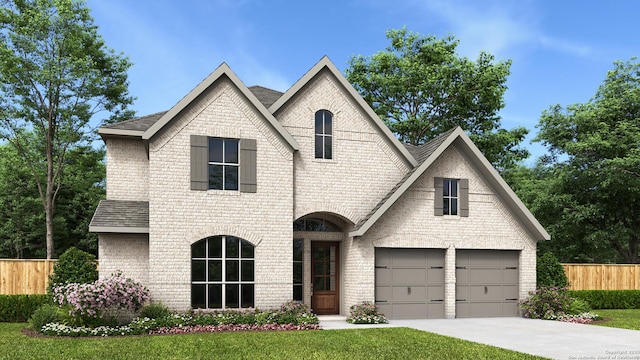 view of front facade featuring a garage and a front lawn