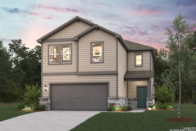 craftsman-style home featuring a garage, stone siding, driveway, roof with shingles, and a front yard