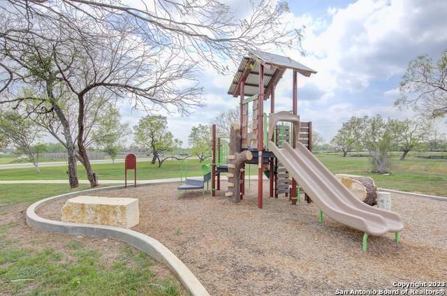 community play area featuring a yard