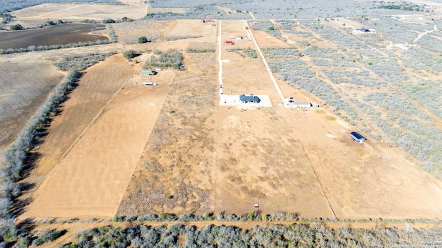 birds eye view of property featuring a rural view