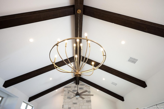 details featuring beamed ceiling and a chandelier