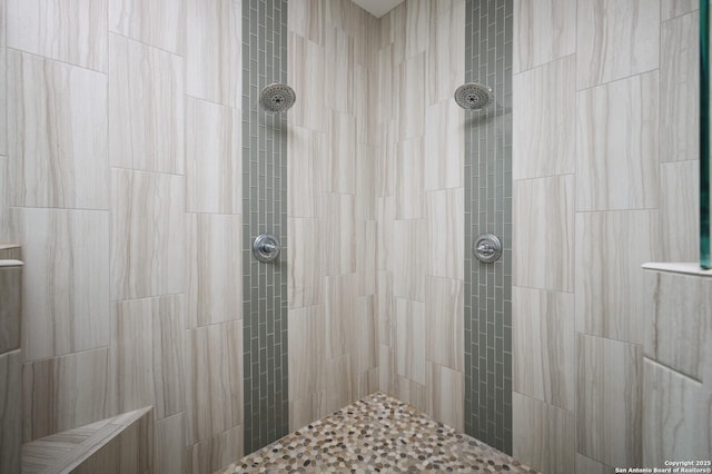 bathroom featuring a tile shower