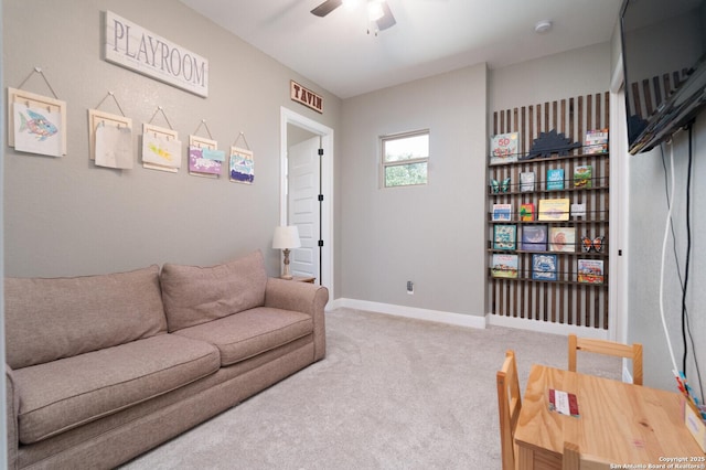 living room with carpet flooring and ceiling fan