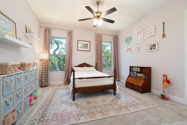 bedroom with ceiling fan and light colored carpet