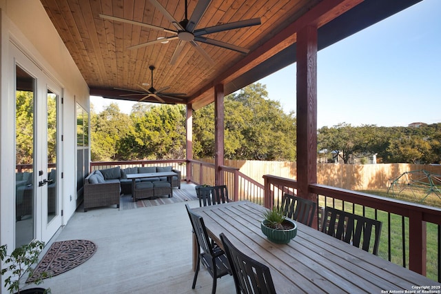 wooden deck featuring ceiling fan and outdoor lounge area