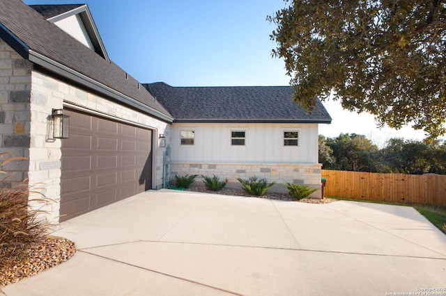 view of side of property featuring a garage