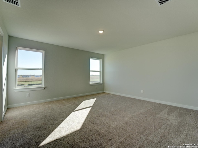 unfurnished room featuring carpet floors