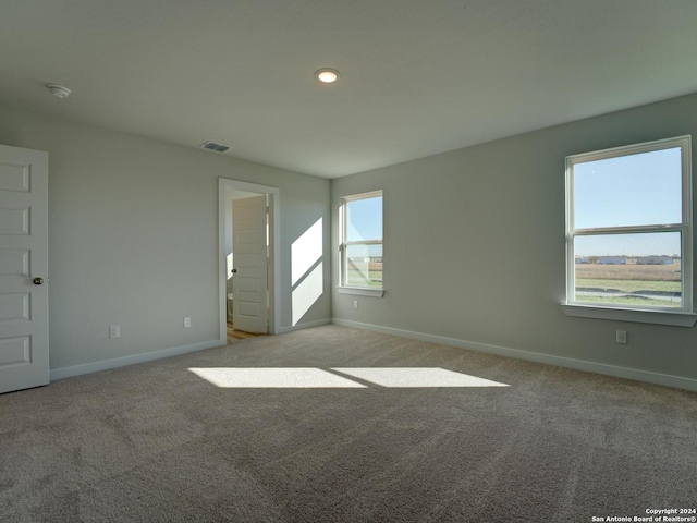 empty room featuring light colored carpet