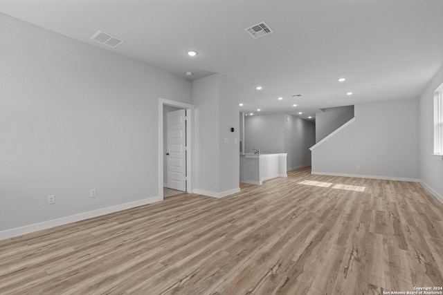 unfurnished living room with light hardwood / wood-style flooring