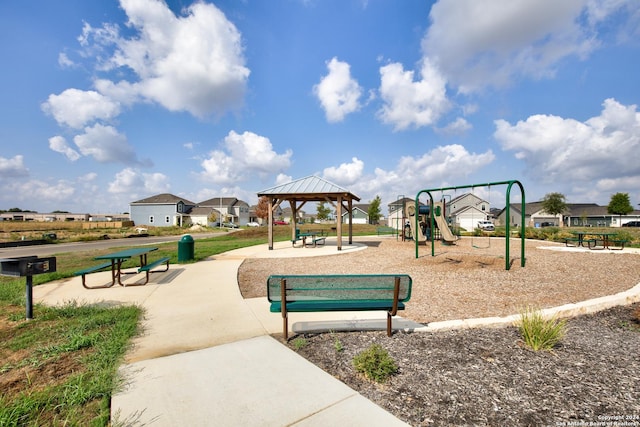 view of property's community featuring a playground and a gazebo