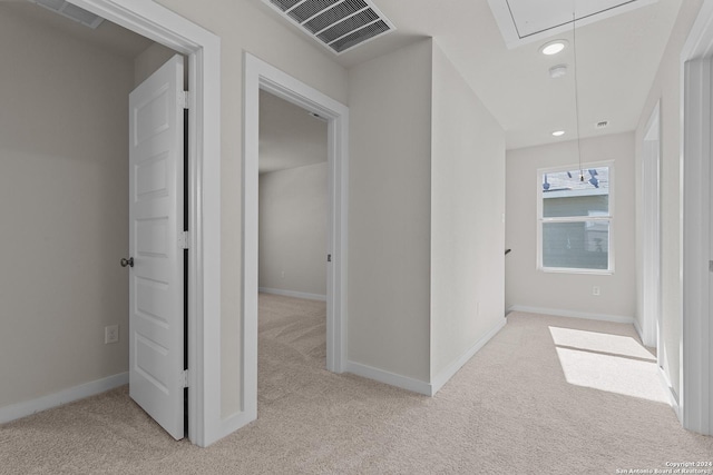 corridor with light carpet