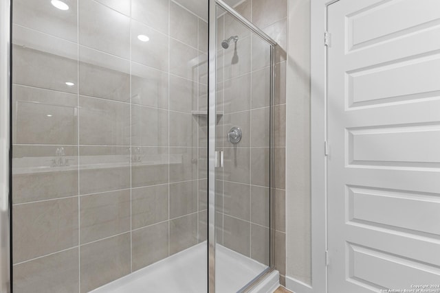 bathroom featuring an enclosed shower