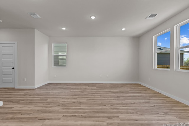 unfurnished room with light hardwood / wood-style flooring