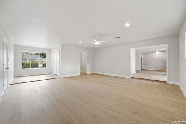 unfurnished living room featuring light hardwood / wood-style floors and ceiling fan