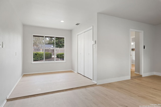 unfurnished room with light hardwood / wood-style flooring