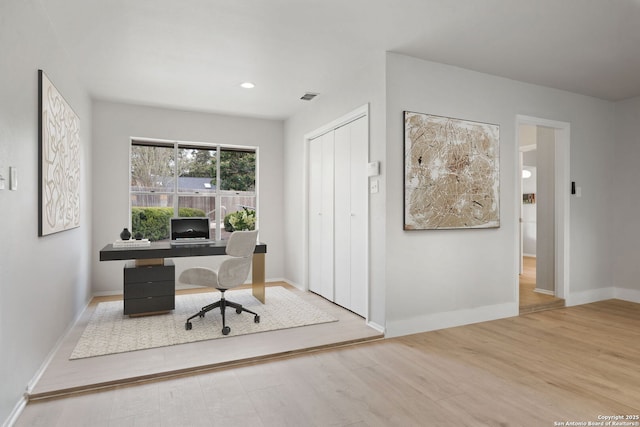 office area with light hardwood / wood-style flooring