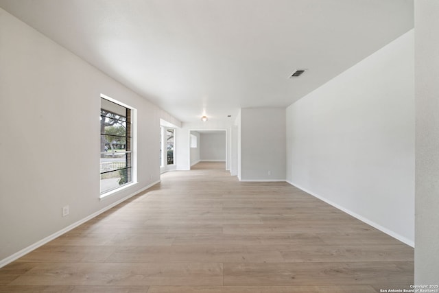 unfurnished room with light hardwood / wood-style floors