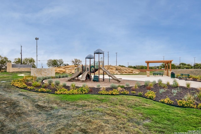 view of jungle gym with a lawn