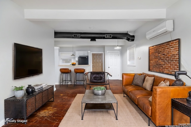 living room with a wall mounted air conditioner and dark wood-type flooring