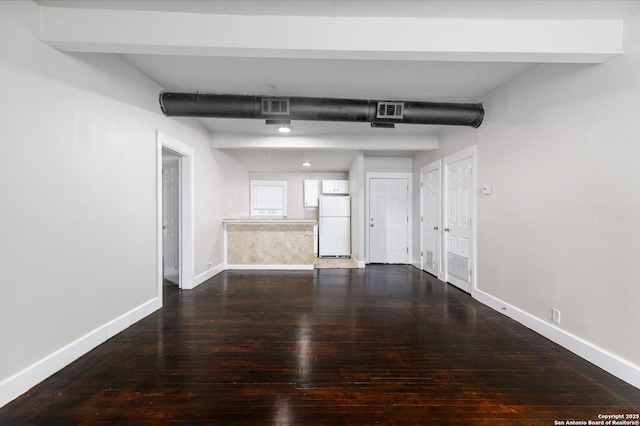 unfurnished room with wood-type flooring