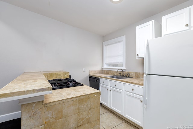 kitchen with sink, white cabinets, and black appliances