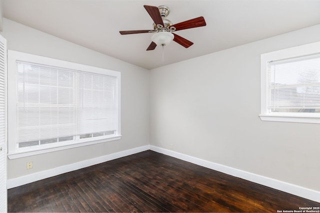 spare room featuring lofted ceiling, ceiling fan, and dark hardwood / wood-style flooring