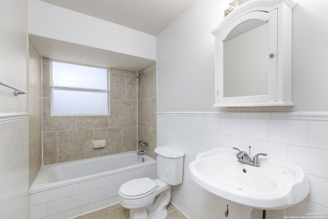 full bathroom with sink, toilet, and tiled shower / bath