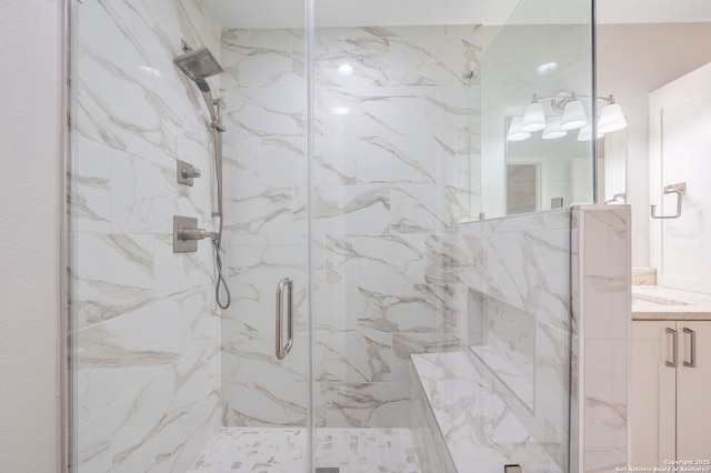 bathroom with vanity and a shower with shower door