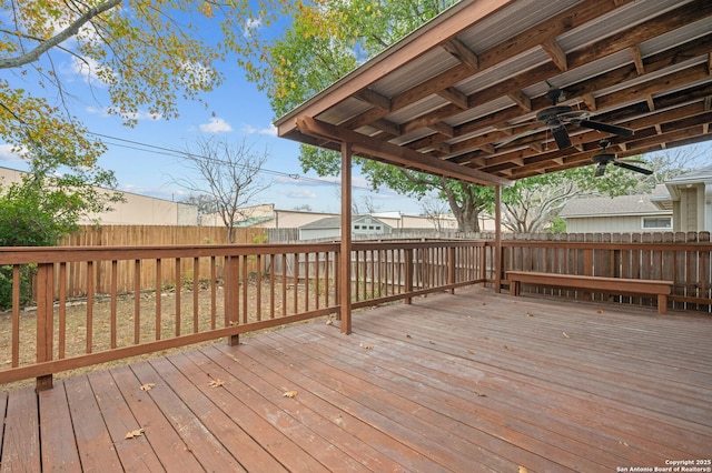 wooden deck featuring ceiling fan