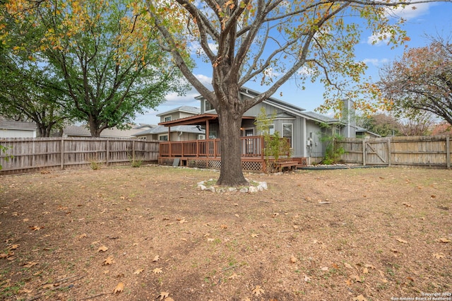 view of yard featuring a wooden deck