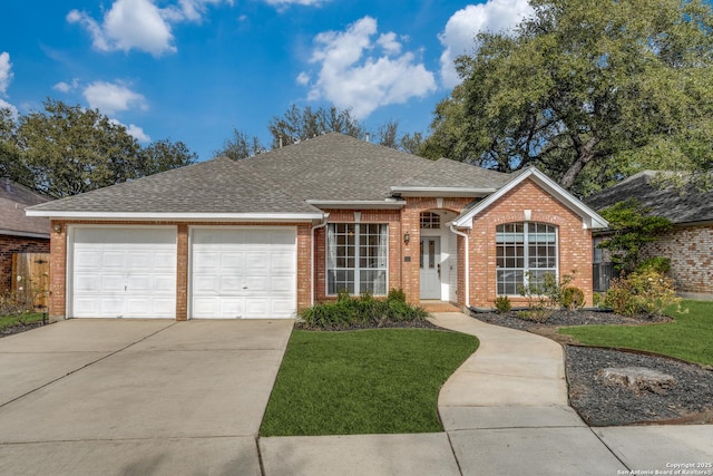 single story home with a garage and a front yard