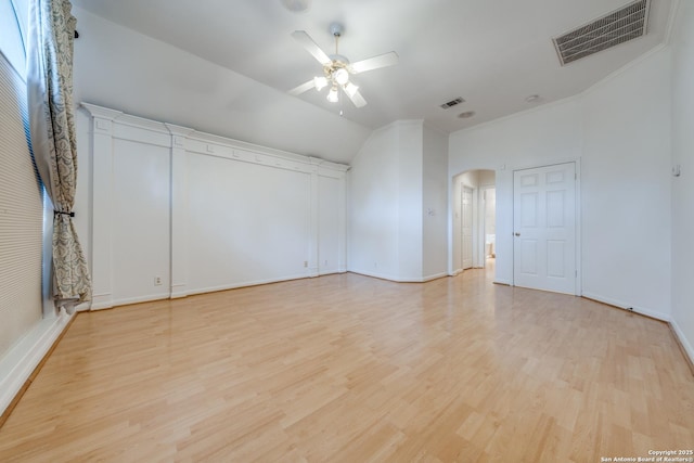 unfurnished room featuring lofted ceiling, light hardwood / wood-style flooring, and ceiling fan