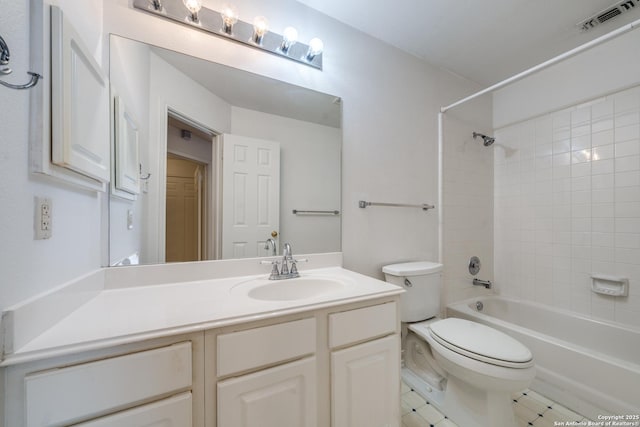 full bathroom with vanity, toilet, and tiled shower / bath combo