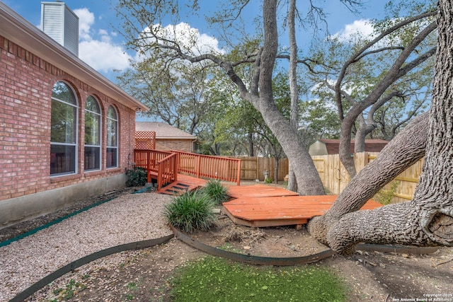 view of yard with a wooden deck