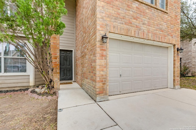 doorway to property featuring a garage